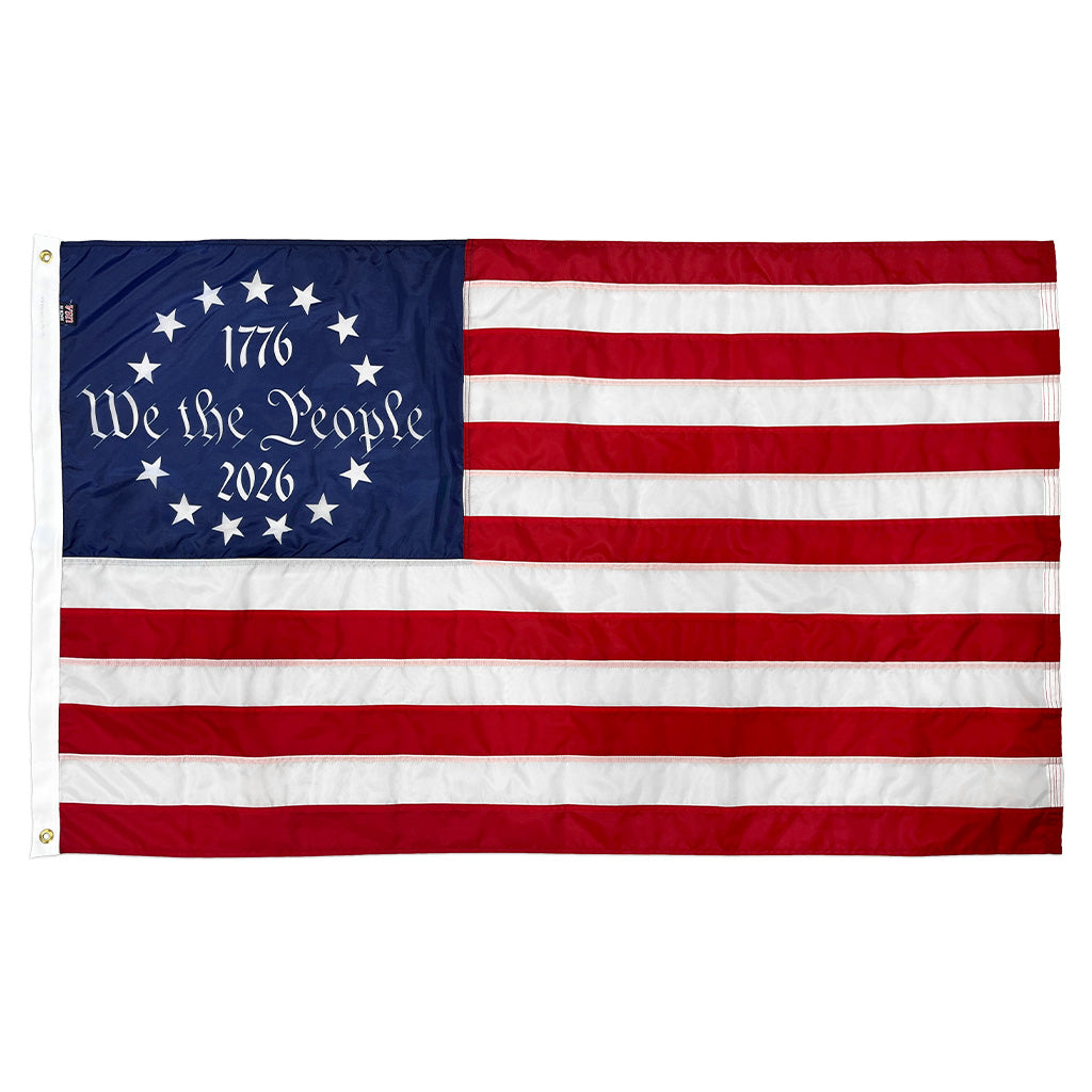 American flag with 'We the People' text and year on a white background
