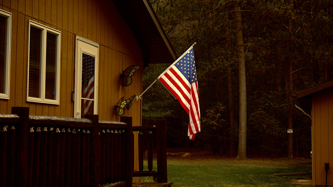 Legacy American flag mounted on cabin